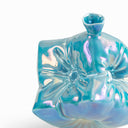 Yifan Renxu dice vase in an iridescent ocean-blue, turquoise and violet glaze, balanced on one corner