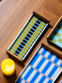 København, Hygge and Måge serving trays by cont. styled on a wooden table with a candle