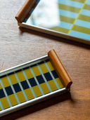 Close-up of the København serving tray by cont., geometric glass pattern with oak handle and steel rail