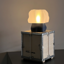 Studio.LUNA L001 lamp switched on with a warm glow through the 3D printed cloud shade