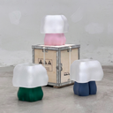 Studio.LUNA 3D printed L001 lamps in pink, green and blue around a wooden shipping crate